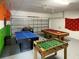 Fun game room featuring ping pong, pool table, and foosball at 256 Sevilla Ave, Davenport, FL 33897