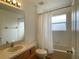 Clean bathroom with a bathtub, shower, and vanity at 256 Sevilla Ave, Davenport, FL 33897