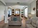 Living room with a view into the dining area and kitchen at 256 Sevilla Ave, Davenport, FL 33897