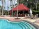 Covered bar area adjacent to the refreshing pool at 256 Sevilla Ave, Davenport, FL 33897