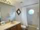 Bathroom with a bathtub, shower, and updated vanity at 256 Sevilla Ave, Davenport, FL 33897