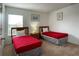 Bedroom with two twin beds and wood furniture at 256 Sevilla Ave, Davenport, FL 33897