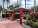 Comfortable lounge chairs with red cabanas for shade at 256 Sevilla Ave, Davenport, FL 33897