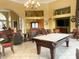 Relax in the clubhouse with a pool table and comfortable seating at 256 Sevilla Ave, Davenport, FL 33897