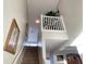 View of carpeted staircase leading to second floor loft area at 256 Sevilla Ave, Davenport, FL 33897