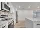 Modern kitchen with stainless steel appliances and white cabinets at 715 Eastover Cir, Deland, FL 32724
