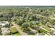 Aerial view showing home's location in a quiet neighborhood with mature trees at 715 Eastover Cir, Deland, FL 32724