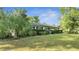 Charming ranch house with a well-manicured lawn and landscaping at 715 Eastover Cir, Deland, FL 32724