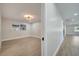 Open living room with wood-look floors and a window at 715 Eastover Cir, Deland, FL 32724