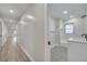 Modern bathroom with white vanity and grey tile flooring at 715 Eastover Cir, Deland, FL 32724