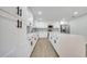 Updated kitchen with white shaker cabinets and large island at 715 Eastover Cir, Deland, FL 32724