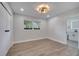 Spacious bedroom with wood-look floors and an ensuite bathroom at 715 Eastover Cir, Deland, FL 32724