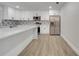 Updated kitchen featuring white cabinets and quartz countertops at 715 Eastover Cir, Deland, FL 32724