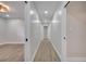 Light and bright hallway with wood-look flooring at 715 Eastover Cir, Deland, FL 32724