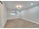 Well-lit bedroom with wood-look floors and a ceiling fan at 715 Eastover Cir, Deland, FL 32724