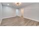 Spacious bedroom with wood-look floors and double doors to closet at 715 Eastover Cir, Deland, FL 32724