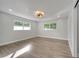 Spacious bedroom featuring hardwood floors and large windows at 715 Eastover Cir, Deland, FL 32724