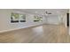 Open living area showcasing hardwood floors and ample natural light at 715 Eastover Cir, Deland, FL 32724