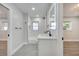 Modern bathroom with white vanity and grey tile floors at 715 Eastover Cir, Deland, FL 32724
