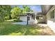 Large backyard with covered patio and plenty of green space at 715 Eastover Cir, Deland, FL 32724