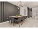Modern dining room with a wood table and gray chairs at 3525 Lavender Dr, Davenport, FL 33897