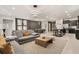 Open living area with gray sectional and views of kitchen and dining area at 3525 Lavender Dr, Davenport, FL 33897