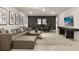 Finished basement with a sectional sofa, game table and large TV at 3525 Lavender Dr, Davenport, FL 33897