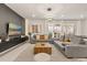 Open living room featuring gray sectional sofa and modern decor at 3525 Lavender Dr, Davenport, FL 33897