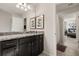 Clean bathroom with granite countertops and dark cabinetry at 3525 Lavender Dr, Davenport, FL 33897