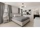 Bright main bedroom with a king-size bed and modern artwork at 3525 Lavender Dr, Davenport, FL 33897