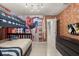 Themed bedroom with a bunk bed and Spiderman wall mural at 3525 Lavender Dr, Davenport, FL 33897