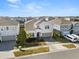 Two-story house with gray exterior and palm trees at 3525 Lavender Dr, Davenport, FL 33897