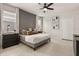 Main bedroom with ceiling fan, gray platform bed, and modern decor at 3525 Lavender Dr, Davenport, FL 33897