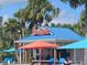 Sign for Rumburellas bar with palm trees at 3525 Lavender Dr, Davenport, FL 33897