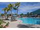 Resort-style pool with palm trees and lounge chairs at 3525 Lavender Dr, Davenport, FL 33897