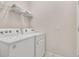 White Whirlpool washer and dryer in a well-lit laundry room at 3525 Lavender Dr, Davenport, FL 33897