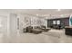 Spacious game room featuring comfortable seating, a game table, and stylish decor at 3525 Lavender Dr, Davenport, FL 33897