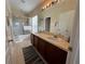 Bathroom with double sinks, a shower/tub combo, and a tiled floor at 10791 Gran Paradiso Dr # S, Orlando, FL 32832