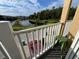 Scenic balcony view overlooking a tranquil lake and community at 10791 Gran Paradiso Dr # S, Orlando, FL 32832