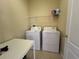 Convenient laundry room with washer, dryer, and additional storage at 10791 Gran Paradiso Dr # S, Orlando, FL 32832