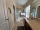 Bathroom with double sinks, a shower/tub combo, and a tiled floor at 10791 Gran Paradiso Dr # S, Orlando, FL 32832