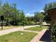 Lakeside walking path with benches and grills at 10791 Gran Paradiso Dr # S, Orlando, FL 32832