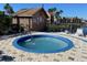 Relaxing hot tub area with adjacent storage shed at 2210 Grand Cayman Ct # 1722, Kissimmee, FL 34741