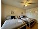 Guest bedroom with two twin beds and a ceiling fan at 2210 Grand Cayman Ct # 1722, Kissimmee, FL 34741