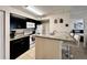 Kitchen with breakfast bar, granite counters, and dark cabinetry at 2210 Grand Cayman Ct # 1722, Kissimmee, FL 34741