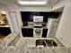 Modern kitchen with granite countertops and stainless steel appliances at 2210 Grand Cayman Ct # 1722, Kissimmee, FL 34741
