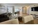 Open living area with tile floors, and a view of dining and kitchen areas at 2210 Grand Cayman Ct # 1722, Kissimmee, FL 34741