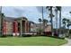 Exterior view of apartment buildings with attractive landscaping at 2210 Grand Cayman Ct # 1722, Kissimmee, FL 34741