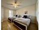 Two twin beds with linens and ceiling fan in guest bedroom at 2210 Grand Cayman Ct # 1722, Kissimmee, FL 34741