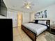 Bright bedroom with a king-size bed and ensuite bathroom at 2210 Grand Cayman Ct # 1722, Kissimmee, FL 34741